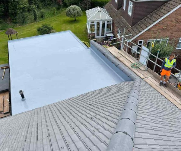 This is a photo of a newly installed hip roof, with a combined liquid covered flat roof. Work carried out by BMT Roofing Wollaston